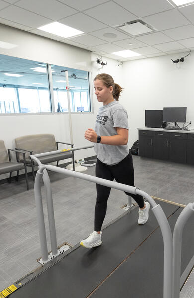 Girl running on performance testing treadmill